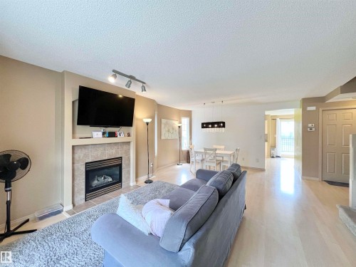 8 4755 Terwillegar Common, Edmonton, AB - Indoor Photo Showing Living Room With Fireplace