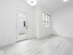 Bright interior space featuring light wood-finish flooring - 