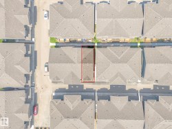 Property outlined in red featuring a rectangular lot, positioned between two paved streets - 