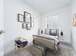 Bright room featuring neutral carpeting, white walls, and a large window with white trim - 
