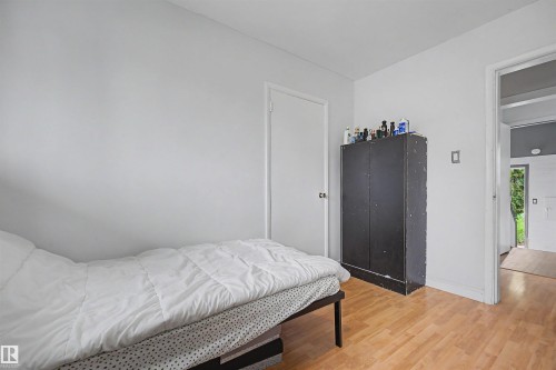 Interior space with light wood-finish flooring and white walls - 12707 87 Street, Edmonton, AB 