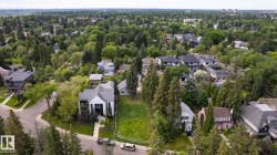 Spacious residential lot with mature trees, surrounded by established homes, offering significant development potential - 