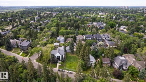 Expansive treed neighborhood with a variety of architectural styles, including contemporary and traditional homes - 14307 Summit Drive Nw, Edmonton, AB 