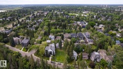 Expansive residential area featuring a diverse collection of single-family homes, mature tree canopy, varied architectural styles, and established streetscapes - 