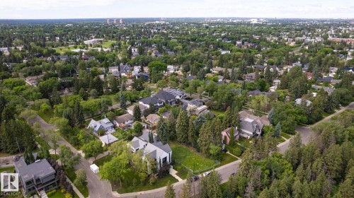 Expansive aerial perspective showcasing a mature residential area with abundant tree cover - 14307 Summit Drive Nw, Edmonton, AB 
