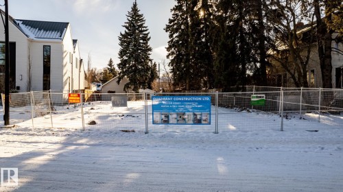 Expansive cleared lot bordered by temporary fencing - 14307 Summit Drive, Edmonton, AB 