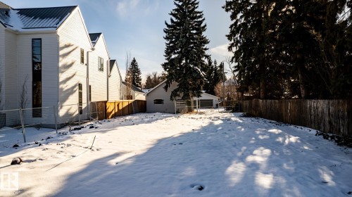 Spacious backyard with mature perimeter trees and wood fencing - 14307 Summit Drive, Edmonton, AB 