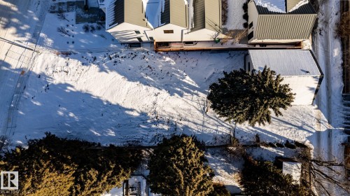 Expansive property lot featuring mature trees and a detached structure - 14307 Summit Drive, Edmonton, AB 