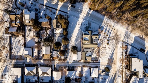 Aerial perspective showcasing a residential area with varied rooflines and surrounding roadways - 14307 Summit Drive, Edmonton, AB 