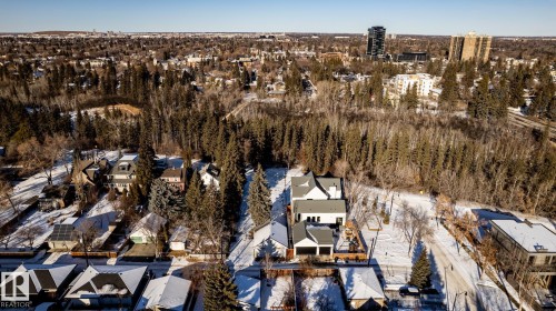 Aerial perspective of a contemporary two-story residence featuring a light-colored exterior and a dark-colored roof - 14307 Summit Drive, Edmonton, AB 