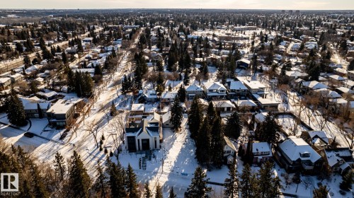 Aerial view showcasing a residential area characterized by mature trees and a mix of architectural styles - 14307 Summit Drive, Edmonton, AB 