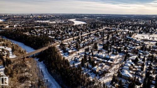Aerial perspective showcasing a residential neighborhood with snow-covered rooftops - 14307 Summit Drive, Edmonton, AB 