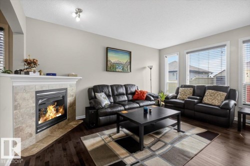 1107 35 Avenue, Edmonton, AB - Indoor Photo Showing Living Room With Fireplace