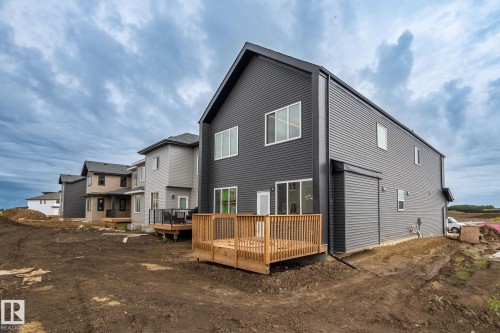 Modern exterior with dark grey horizontal siding and vertical paneling - 13111 187 Avenue Nw, Edmonton, AB - Outdoor