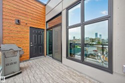 Spacious outdoor patio with wood-finish decking - 