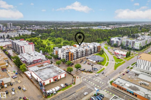 Aerial perspective showcasing urban surroundings with tree-lined green spaces - 410 10531 117 Street, Edmonton, AB 