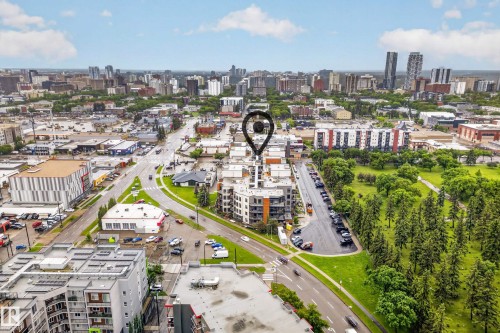 Aerial perspective of an urban setting featuring a multi-story building with balconies - 410 10531 117 Street, Edmonton, AB 