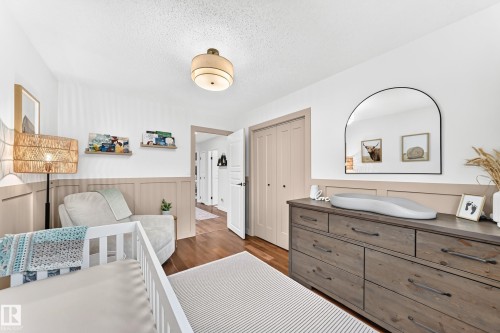 Room featuring a wood-finish floor and white ceiling - 15146 Ramsay Crescent, Edmonton, AB 