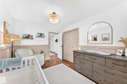 Room featuring a wood-finish floor and white ceiling - 