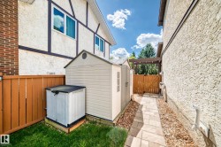 Path with paver stone surfacing, flanked by wood chip landscaping - 