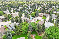 Expansive residential neighborhood featuring numerous mature trees and substantial green spaces - 