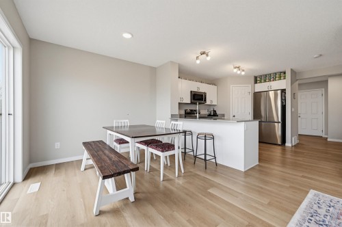 Open-concept living space featuring light wood-finish flooring - 56 Springbrook Wynd, Spruce Grove, AB - Indoor