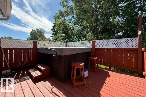 Patio Doors off Primary to Hot Tub, also access to deck from the yard. - 4823 10 Avenue, Edmonton, AB 