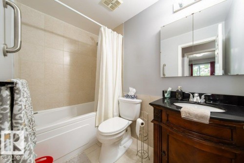 Tiled shower and floor, 4 piece main bath - 4823 10 Avenue, Edmonton, AB 