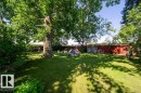 Massive, fully fenced back yard with a gate out to a walking space behind property. - 4823 10 Avenue, Edmonton, AB 