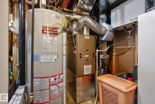 Utility area featuring a water heater, furnace, and additional mechanical systems - 39 Meadowview Court, Spruce Grove, AB 