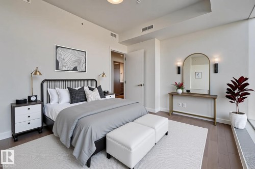 Bedroom featuring wood-finish flooring, recessed lighting, and a window with a deep sill - #3901 10360 102 St Nw Nw, Edmonton, AB - Indoor Photo Showing Bedroom