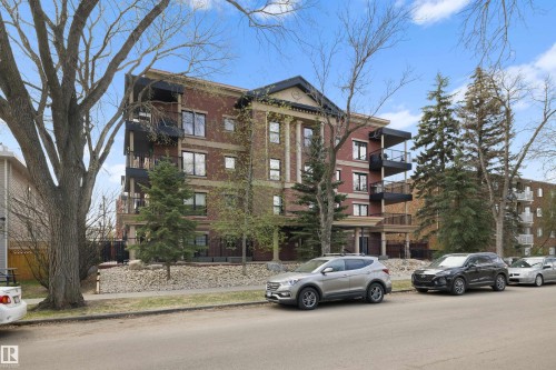Brick exterior building featuring multiple private balconies with black railings - #206 10232 115 St Nw, Edmonton, AB 
