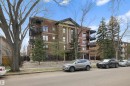 Brick exterior building featuring multiple private balconies with black railings - #206 10232 115 St Nw, Edmonton, AB 