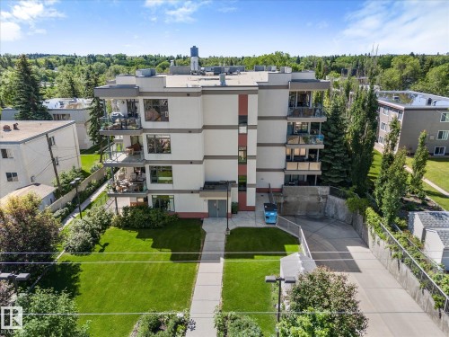 Multi-story residential building with a contemporary design featuring numerous balconies - 408 11140 68 Avenue, Edmonton, AB 