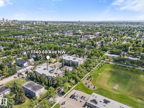Aerial view of a residential area featuring a multi-story building marked at 11140 68 Ave NW - 408 11140 68 Avenue, Edmonton, AB 