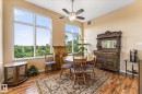 High ceilings complement tall windows, offering expansive outdoor scenery - 408 11140 68 Avenue, Edmonton, AB 