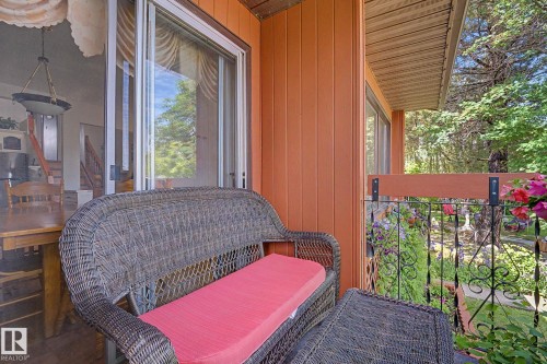 Outdoor balcony with horizontal siding and a wrought iron railing - 10242 161 Street, Edmonton, AB 