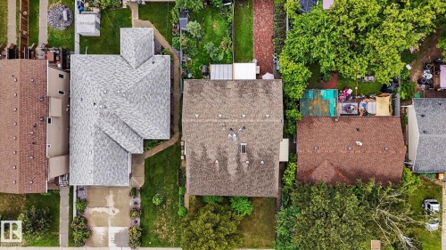 Aerial perspective showcasing three residential properties with varied roofing materials - 10242 161 Street, Edmonton, AB 