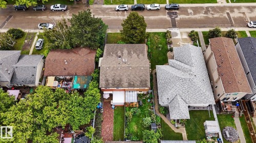 Brown shingle roofing on a multi-level structure with a brick pathway - 10242 161 Street, Edmonton, AB 