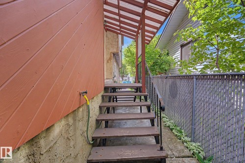 Exterior stairs with metal railings providing access to an upper level - 10242 161 Street, Edmonton, AB 
