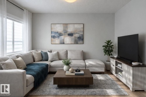 Virtually staged. Living area featuring wood-finish flooring, light grey painted walls, and a large window with privacy blinds and sheer curtains - 9952 227 Street, Edmonton, AB 