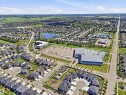 Expansive aerial rendering a residential neighborhood with varied housing styles - 5110 Rue Eaglemont, Beaumont, AB 