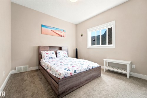 Neutral-toned walls complement the clean white trim and plush carpeting - 5110 Rue Eaglemont, Beaumont, AB 