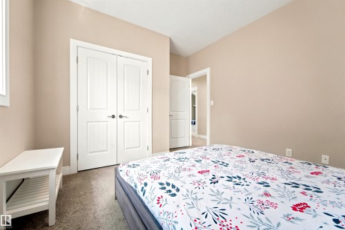 Neutral-toned walls complement carpeted flooring - 5110 Rue Eaglemont, Beaumont, AB 