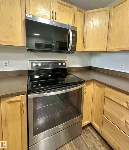 Stainless steel electric range with a coordinating over-the-range microwave - 318 646 Mcallister Loop, Edmonton, AB 