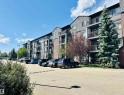 Multi-story building exterior featuring a combination of horizontal siding and shingle accents - 318 646 Mcallister Loop, Edmonton, AB 