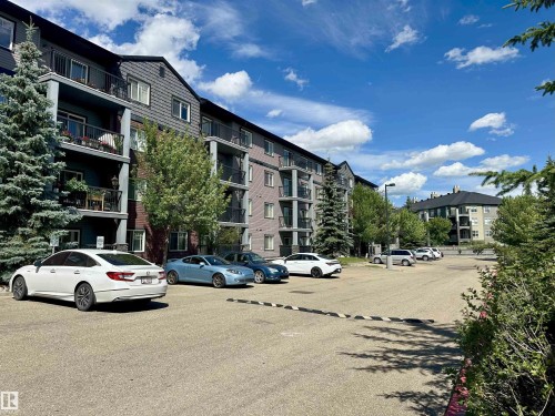 Multi-story residential building with private balconies and exterior siding - 318 646 Mcallister Loop, Edmonton, AB 