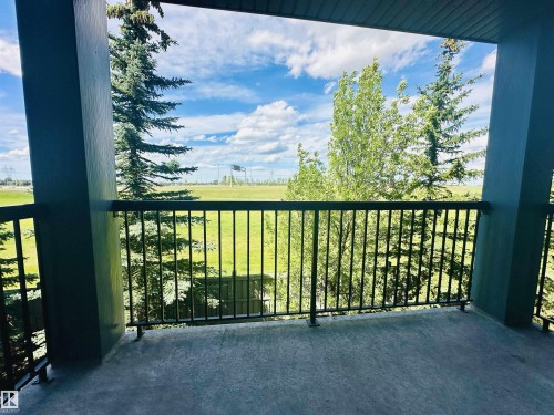 Private balcony featuring a concrete floor and black metal railing - 318 646 Mcallister Loop, Edmonton, AB 