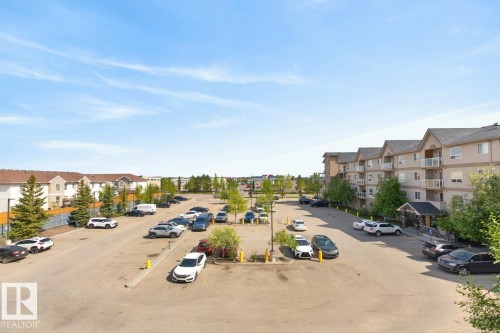Multi-story residential building featuring balconies and gabled rooflines - 320 5005 165 Avenue, Edmonton, AB - Outdoor With View