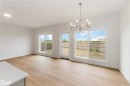 Open-concept living space with light wood-finish flooring - 19360 29 Avenue, Edmonton, AB 